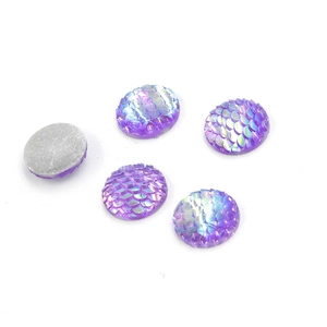 Macro detail of 14mm iridescent fish scale resin cabochons with grey flat back base