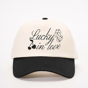 Two-tone baseball cap in black and white with Lucky in love embroidery and dice pattern