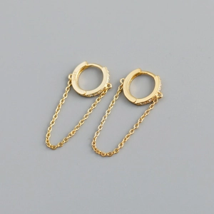 Close-up of gold chain hoop earrings showing the S925 silver hallmark and polished finish