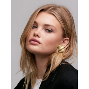 Close-up of 18K gold stainless steel square earrings with wave texture on model ear
