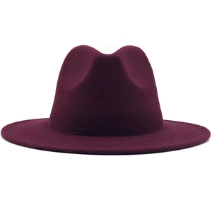 Close-up of deep burgundy wool felt fedora showing texture and flat brim detail