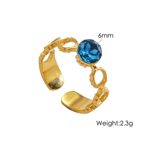 Detail of a 6mm blue gemstone on a gold adjustable ring weighing 2.3 grams