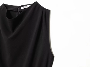 Detail of elegant black high-neck vest showing ZEDeRI label and hidden back zipper