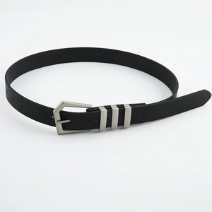 Detail of black leather belt with silver matte metal buckle and decorative triple ring loops