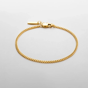 Close-up of minimalist gold-plated stainless steel curb chain bracelet for men