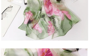 Detail showing sheer floral silk scarf with pink lotus print and light ink painting style