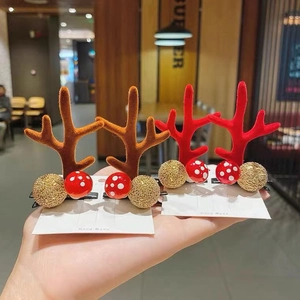 Two pairs of festive Christmas reindeer antler hair clips with mushroom and gold glitter balls