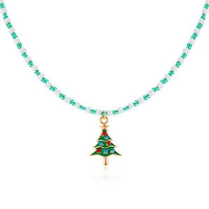 Macro view of beaded Christmas necklace featuring a green festive tree charm with star