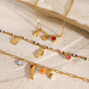 18K gold plated stainless steel bracelet set with pearls, sea stars, and fish charms