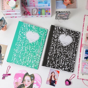 Detailed flat lay of marble green and black A5 binder covers for photo card collections