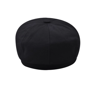 Detail view of the black octagonal hat top showing textured fabric and center button