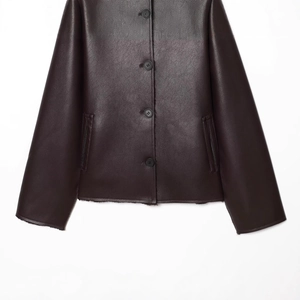 Women's dark brown faux leather reversible jacket with warm shearling lining detail