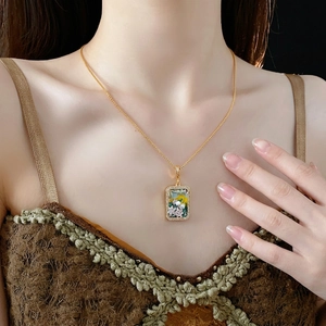 Vintage gold necklace with zircon flower pendant and freshwater pearls on elegant model