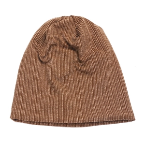 Detailed texture of brown ribbed knit beanie hat showing soft elastic fabric