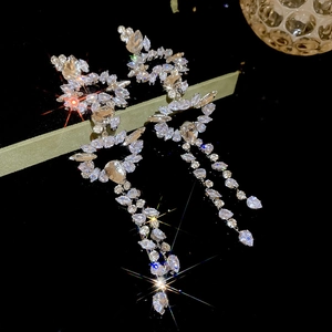 Macro shot of silver drop tassel earrings with sparkling marquise and pear-cut cubic zirconia