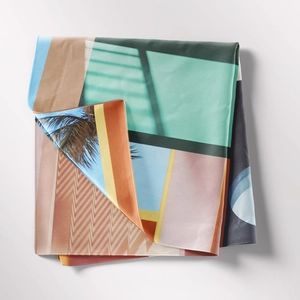 Close-up of geometric abstract print on high-quality silk scarf with palm tree patterns