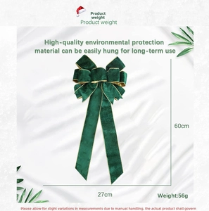 Detailed view of dark green velvet Christmas bow with gold edges measuring 60cm by 27cm