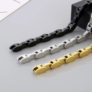Detailed view of luxury stainless steel link bracelets in black, silver, and gold finishes