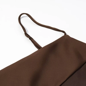 Close-up of silk texture brown camisole with adjustable straps and metal buckles