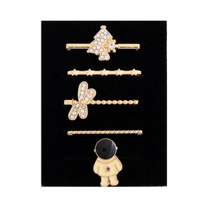 Detailed set of 5 golden decorative charms for silicone watch bands on black velvet