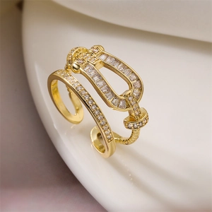 Macro shot of gold-plated double-layer open ring featuring a sparkling zircon U-shape buckle