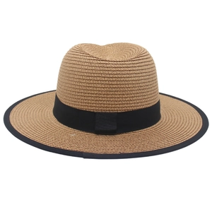Detailed view of summer Panama straw hat featuring black ribbon and textured brim