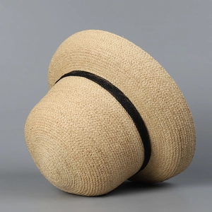French raffia straw hat for women with elegant round top and black ribbon decoration