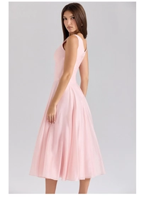 Detail of pink sleeveless midi dress with cinched waist and elegant pleated A-line skirt