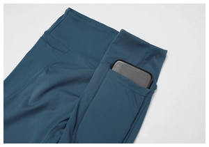 Detail view of high waist yoga leggings with side pocket for phone storage