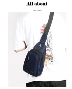Detail view of water-resistant navy blue oxford fabric and multi-zipper pocket structure