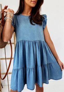 Detail of short ruffle sleeves and tiered skirt on a casual blue denim summer dress