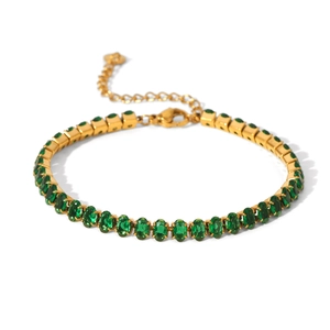 Detail of gold-plated stainless steel bracelet featuring prong-set green oval zircons