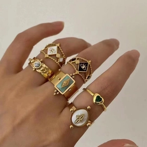 Set of 6 gold-plated vintage rings featuring evil eye patterns and turquoise stones