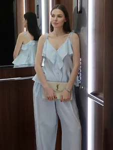 Blue cotton set with ruffle camisole top and wide-leg pants for a summer casual look
