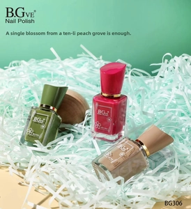 Close-up of three 14ml nail polish bottles in green, pink and nude brown tones