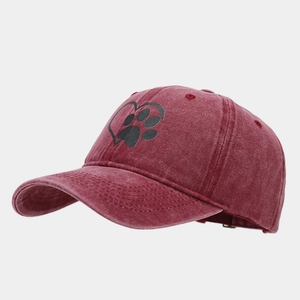 Close-up of burgundy cotton baseball cap with heart and paw print embroidery