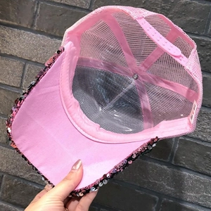 Detailed close-up of pink sequin mesh baseball cap showing breathable texture and back strap