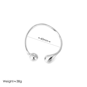 Detailed view of silver droplet cuff bracelet showing 60mm diameter and 38g weight