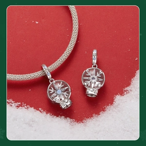 Macro shot of silver snowflake crystal ball bead with zimcon inlay for DIY jewelry