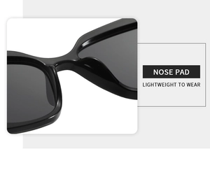 Detail of ergonomic integrated nose pads on lightweight black butterfly frame sunglasses
