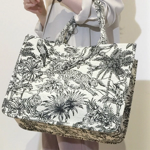 Detail of Toile de Jouy tiger embroidery on a large canvas tote bag for women