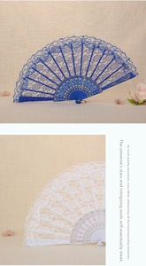 Close-up of vintage lace folding fans with elegant gold patterns and intricate lace edges