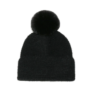 Close-up of black knit beanie texture and fluffy faux fur pompom detail on top