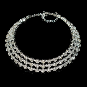 Close-up of triple-layer silver-plated rhinestone necklace with adjustable claw chain links