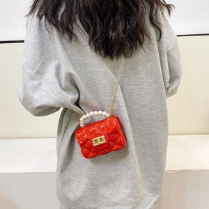 Red quilted mini jelly bag with pearl handle and gold chain strap for kids
