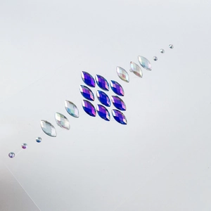 Face gem stickers with iridescent rainbow rhinestones for creative stage makeup looks