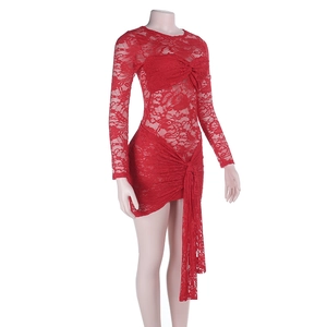 Close-up of red lace dress detailing twisted knot front and side drape on mannequin
