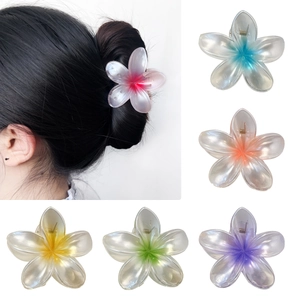 Elegant plumeria flower hair claws in six gradient colors with matte frosted finish