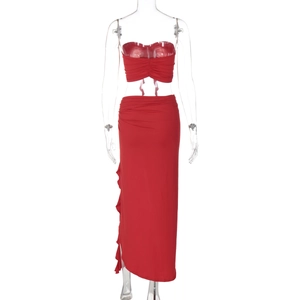 Detail of red two-piece set featuring strapless tube top and side ruched maxi skirt