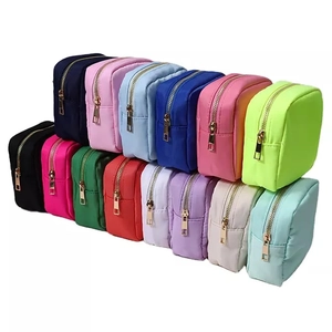 Waterproof nylon makeup bags in multiple colors with luxury gold zippers for travel